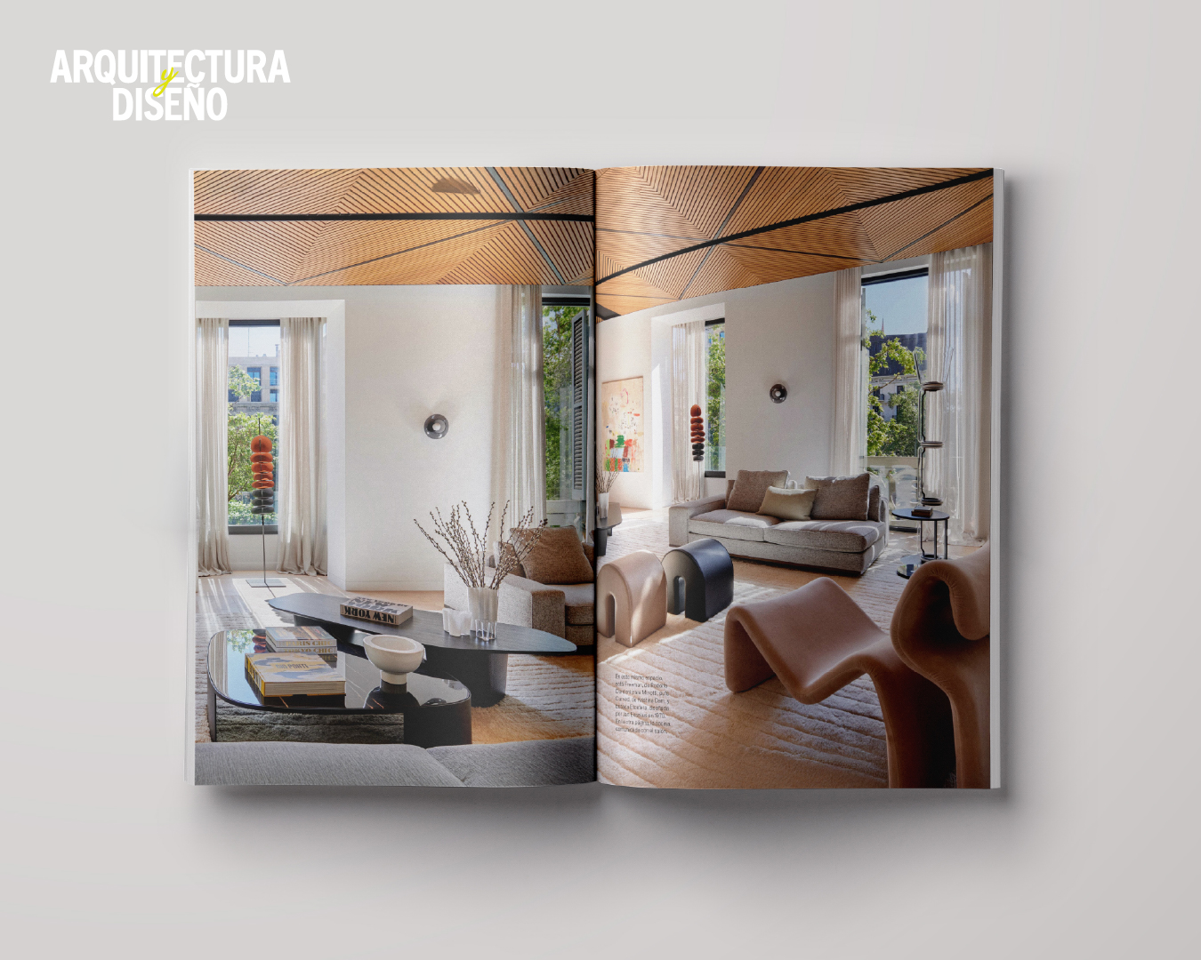 Contemporary interior design space with a bright living room, sculptural pieces, and large windows